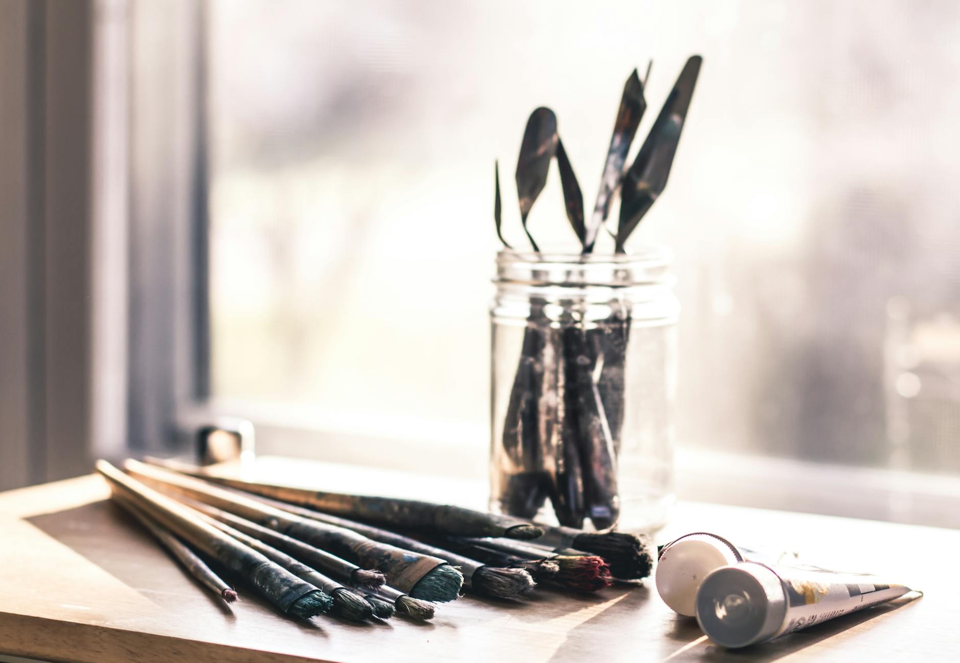 selective focus photography of paint brush set